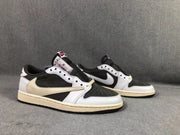 Pair of low-top sneakers shown from the front three-quarter angle with white, black, and brown color blocking.