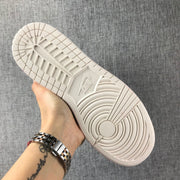 Underside view showing the light-colored rubber outsole with circular and segmented traction patterns.