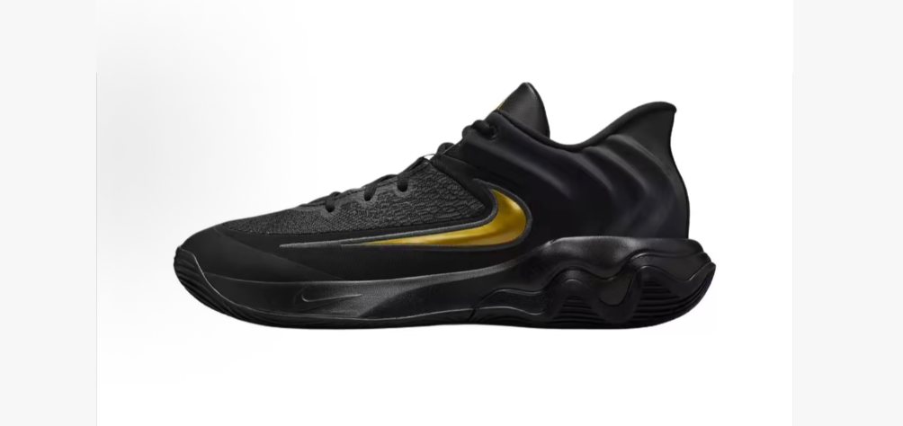 Side view of black Nike basketball shoes with a gold-tone Swoosh and sculpted sole