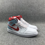 Front three-quarter view of the pair with white uppers, red Swooshes, and ice blue collars.