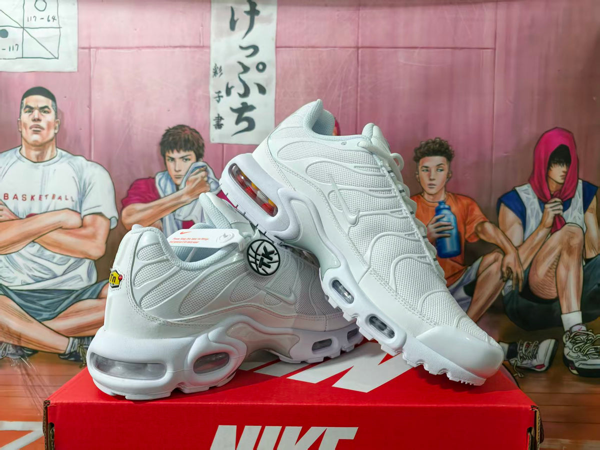 Pair of white Nike sneakers displayed on a red Nike shoe box, showing layered uppers, side Swoosh logos and visible air cushioning units.