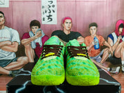 Front view of green Nike sneakers with dark brown laces, bright yellow lace accents, and bright green soles.