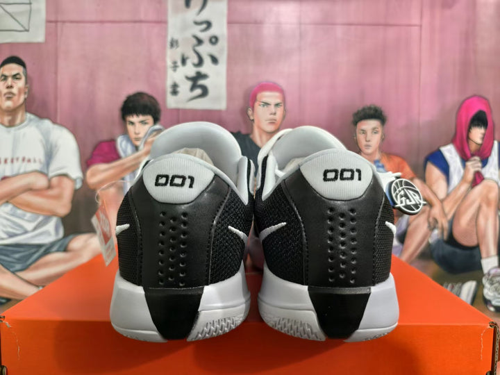 Rear view of black and white Nike GT Cut Academy basketball shoes