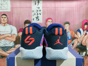 Rear view showing contrasting heel logos and coral-striped pull tabs