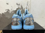 Rear view of light blue Nike basketball shoes showing silver-tone heel panels and signature-style detailing.