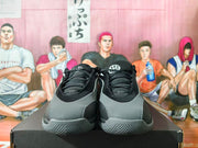 Front view of black and grey Jordan Tatum 2 basketball shoes with laces and grey toe panels.