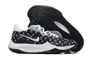Black basketball shoe with white repeating monogram-style graphics and a black outsole.