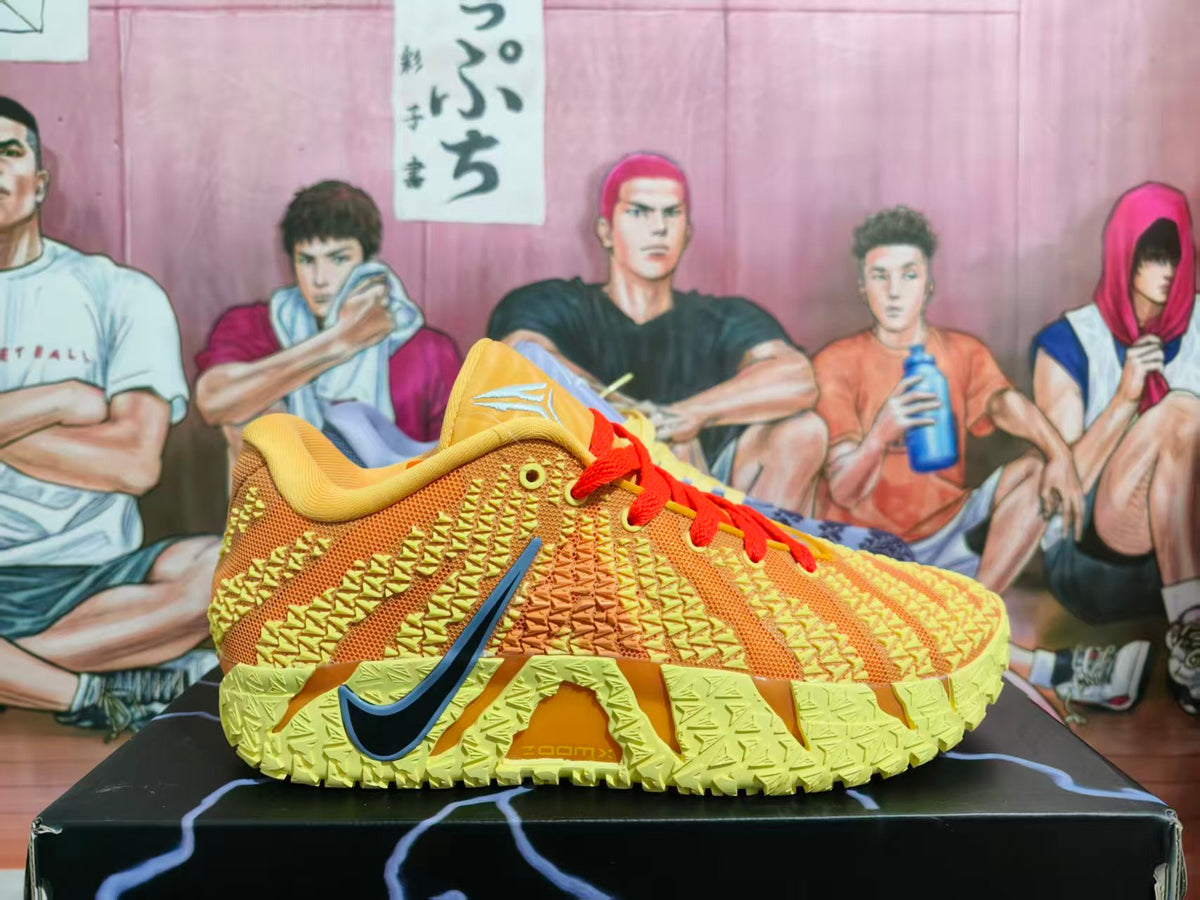 Side view of an orange and yellow Nike basketball shoe with red laces and a dark blue Swoosh.