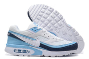 Side view of the Nike Air Max sneakers with visible heel cushioning and outsole tread.