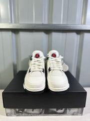 Front view of the pair showing white uppers, mesh toe panels, and black outsole edges.