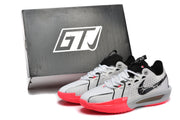 Nike GT Cut 3 basketball shoes in white, gray, black, and bright red, shown beside a box.