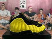 Side profile showing the sculpted yellow panels and black sole