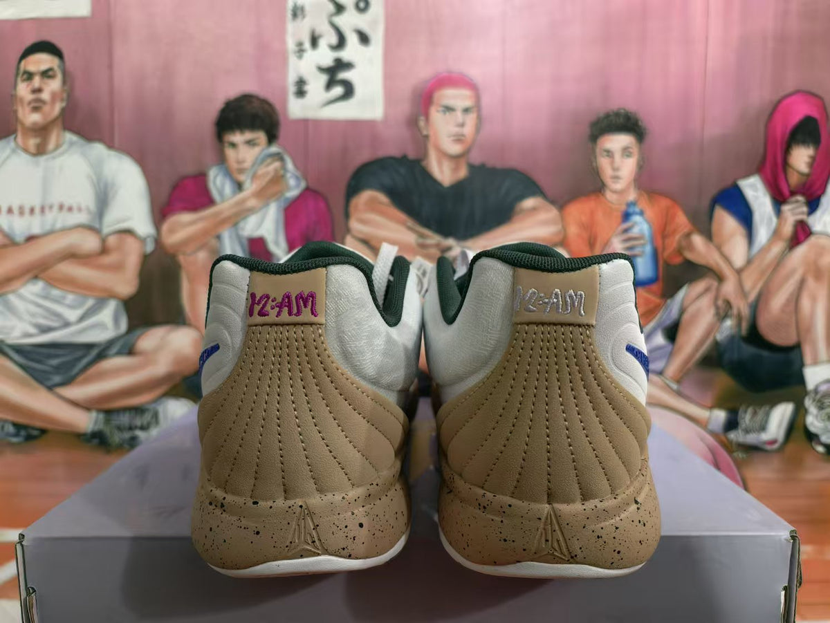 Rear view of white and tan basketball sneakers with dark green collar lining and Uncle Drew-themed artwork in the background.