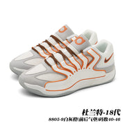 White and gray basketball sneakers with orange accents and brown laces; image text identifies style 8805-9.