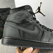 Close-up of the tonal winged basketball logo, Swoosh, eyelets, and stitching.