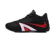Side view of a black sneaker with red and white accents