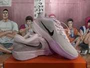 Angled view of the pair highlighting the black swoosh, perforated upper and pink outsole.