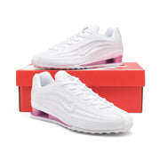 White and pink Nike Shox Z R2 sneakers displayed on a red shoe box