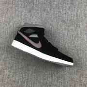 Side view of a black Air Jordan 1 Mid sneaker with a grey and red-edged Swoosh, white midsole and grey outsole.