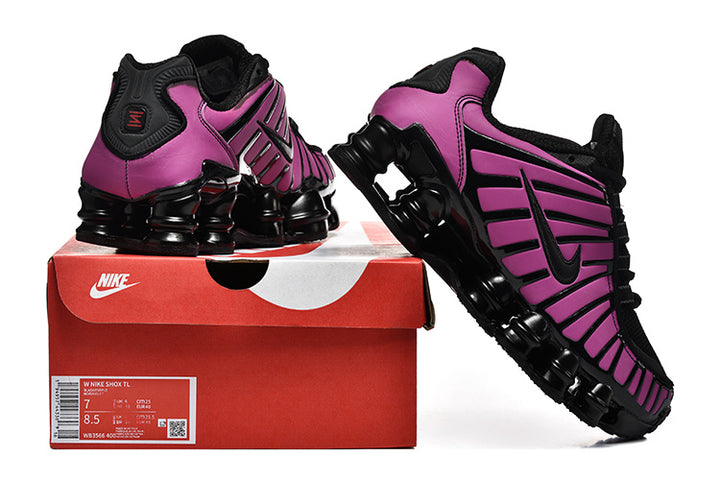 Purple and black Nike Shox TL sneakers displayed on a red shoe box with a size label.