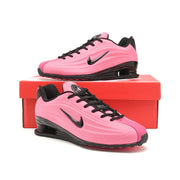 Pink and black Nike Shox Z R2 sneakers displayed on a red shoe box