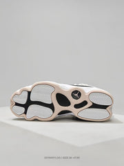 Bottom view showing the segmented outsole with herringbone-patterned traction sections and a Jumpman emblem.