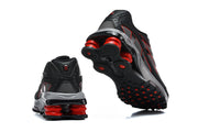 Rear and outsole views of the Nike Shox Ride 2 sneakers, showing red cushioning columns.