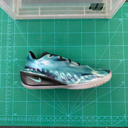 Basketball shoe shown from the opposite side on a green measuring mat