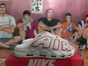 Side view highlighting the oversized outlined lettering and thick white sole with visible cushioning elements.