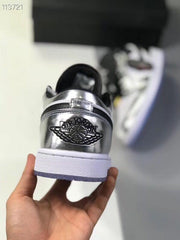Rear view showing the silver heel panel, winged basketball emblem and white midsole.