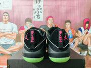 Heel view of black Jordan Luka 1 shoes with pink Jumpman graphics and green outsole accents