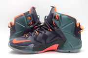 Front and side view of dark high-top basketball sneakers with orange trim, purple accents, and translucent soles.