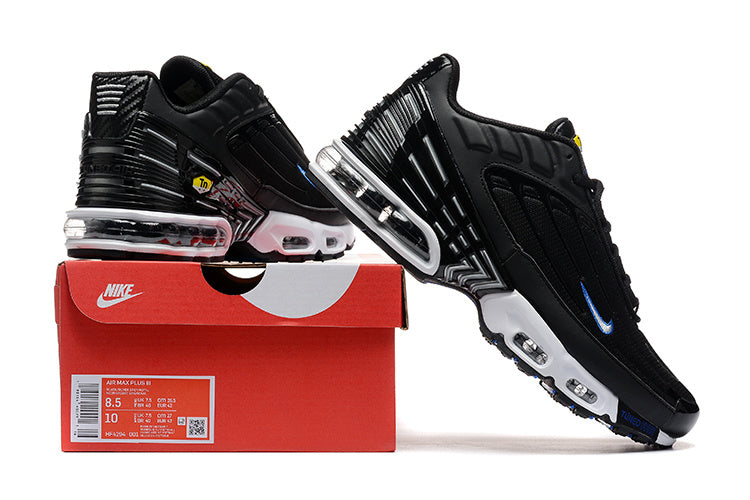 Black and blue Nike Air Max Plus TN sneakers displayed on a box; the box label shows the photographed sample size.