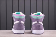 Rear view of the pair showing lavender heel panels, white midsoles and teal collar accents.