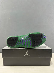 Outsole view showing green rubber, black traction sections, purple accents, and Jordan branding.