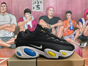 Side view of a black sneaker with a visible Nike Swoosh, textured panels, and blue and yellow oval midsole accents.