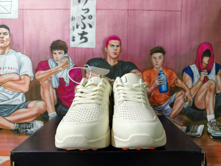 Front view of white perforated Nike low-top sneakers