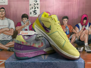 Angled view of the mismatched pair, highlighting the yellow sneaker, purple-gray sneaker, contrasting stitching, and multicolor sole details.