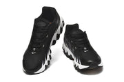 Front and top views of black Nike lace-up sneakers with white Swoosh logos and white sole accents.