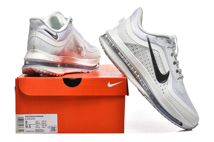 Nike Pegasus Premium shoes beside an orange shoebox; the label shows a sample size.