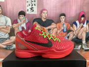 Side view of a red sneaker with a textured upper, black swoosh and translucent red heel structure.