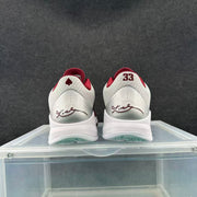 Rear view showing Kobe details, the number 33, and red-and-silver heel accents.