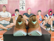Rear view of brown Nike low-top sneakers showing patterned heel panels and mint-tone sole details.
