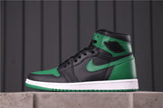 Side profile of the sneaker showing the ankle emblem, green overlays, black upper, and green outsole.