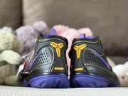 Rear view of the pair showing yellow Kobe-style logos, purple outsoles and contrasting stitching.