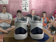 Rear view showing the grey padded collars, patterned heel panels, and dark blue heel sections.