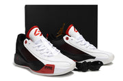 White, black and red Luka.77 sneaker pair displayed in front of a black Jordan shoebox.