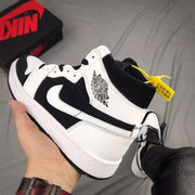 Close angled view of the side and heel area with the Jordan Wings logo and yellow hangtag.