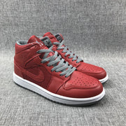 Pair of red high-top sneakers shown from the front and lateral angle.