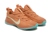 Pair of warm orange Nike LeBron TR1 basketball shoes